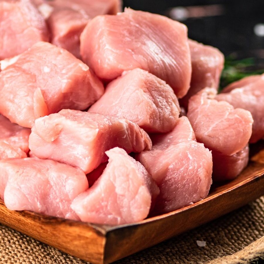 Chopped raw pork with a sprig of cherry tomatoes.